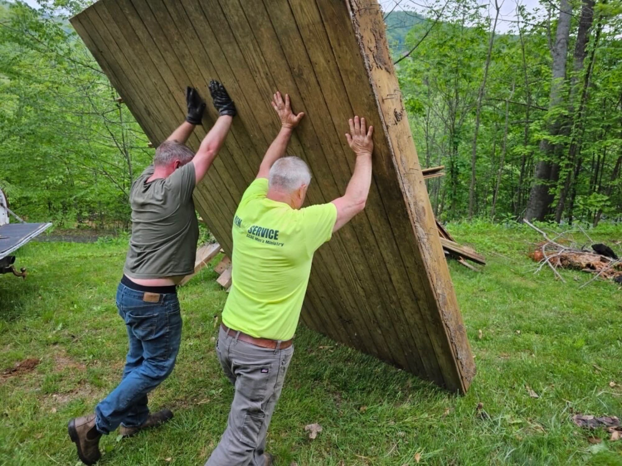 Homesteader Construction crew raising a wall panel on a job site in the NC High Country